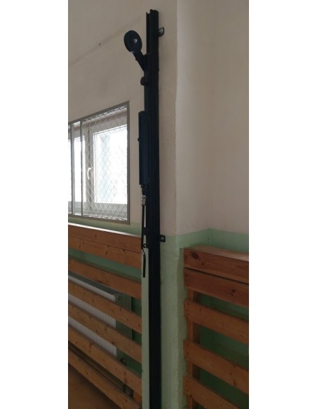 Volleyball stands are mounted to the wall